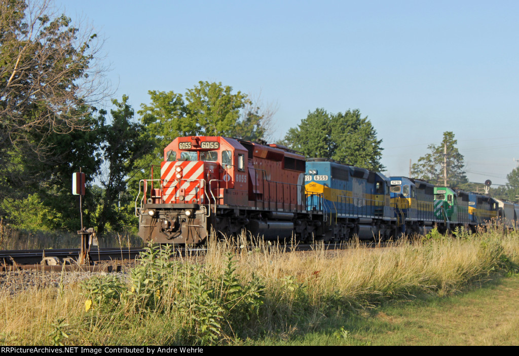 277 rumbles into the sunset with five EMDs and about 30 cars